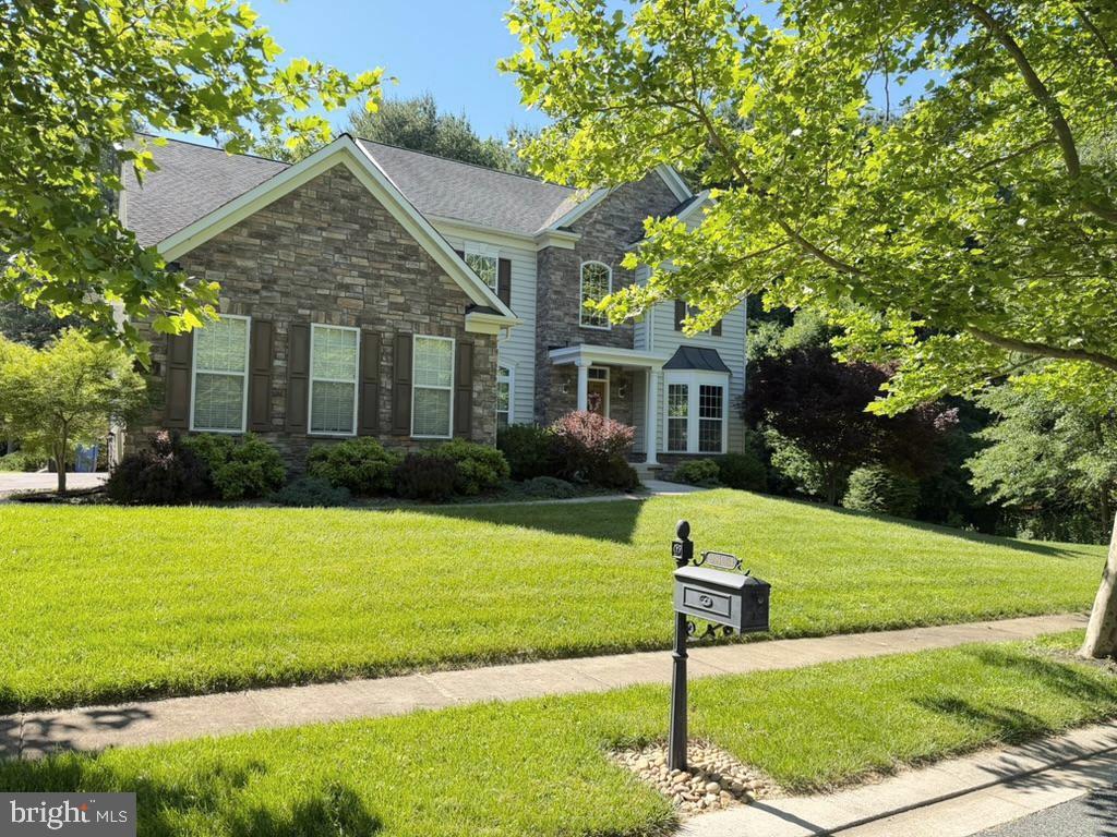 9804 Anvil Court Perry Hall, MD 21128 - Photo 2 of 21 a front view of a house with a yard and trees