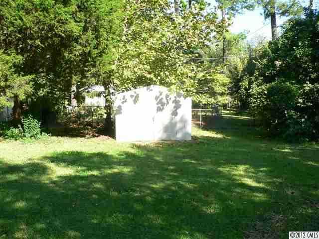 717 Belleview Road Rock Hill, SC 29730 - Photo 3 of 8 a view of a garden with a tree