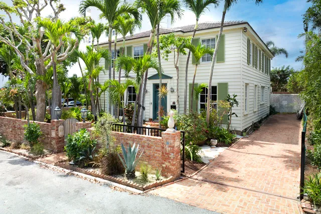 a view of a house with garden and plants