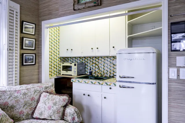 a bedroom with furniture and a window