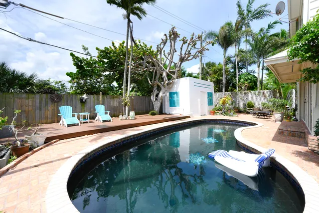 a view of a swimming pool with a patio