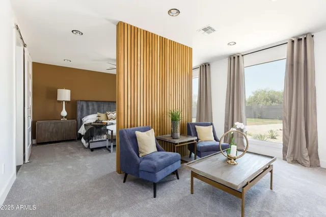 a living room with furniture and a window