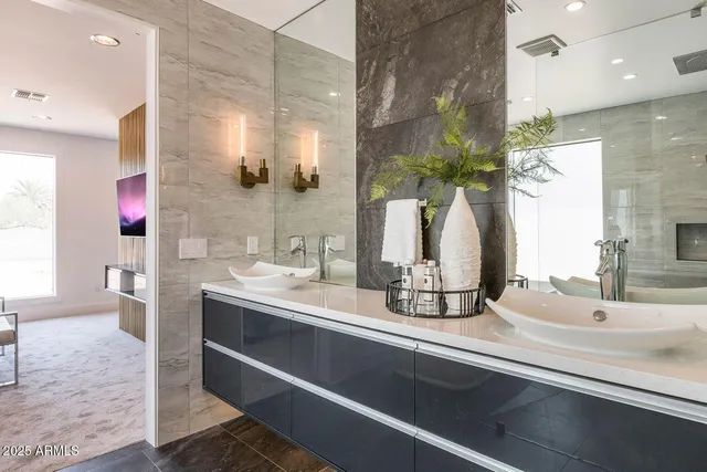 a view of walk in closet and bedroom