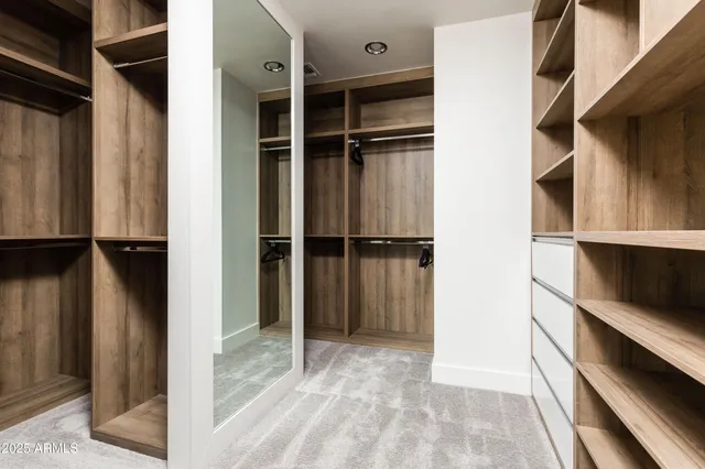 a bedroom with a bed and a lamp