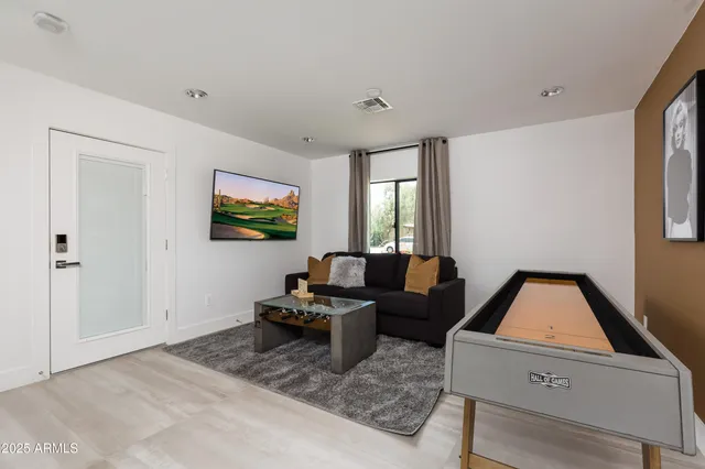 a living room with furniture and a window