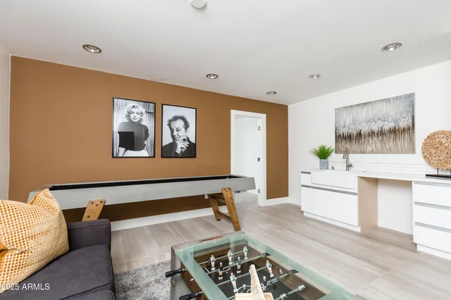 a bedroom with two beds and a window