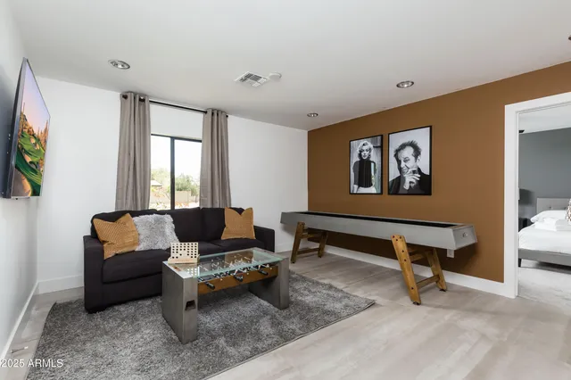 a bedroom with a bed and a lamp