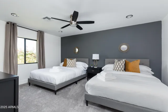 a bedroom with a bed and window