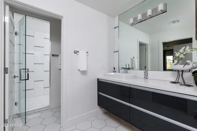 a bedroom with furniture and a potted plant