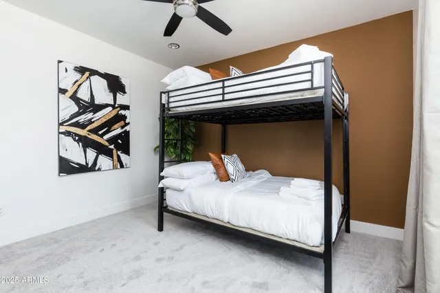 a view of a room that has a bed