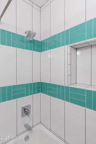 a view of a swimming pool with lounge chairs