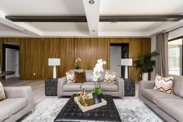 a living room with fireplace furniture and a flat screen tv