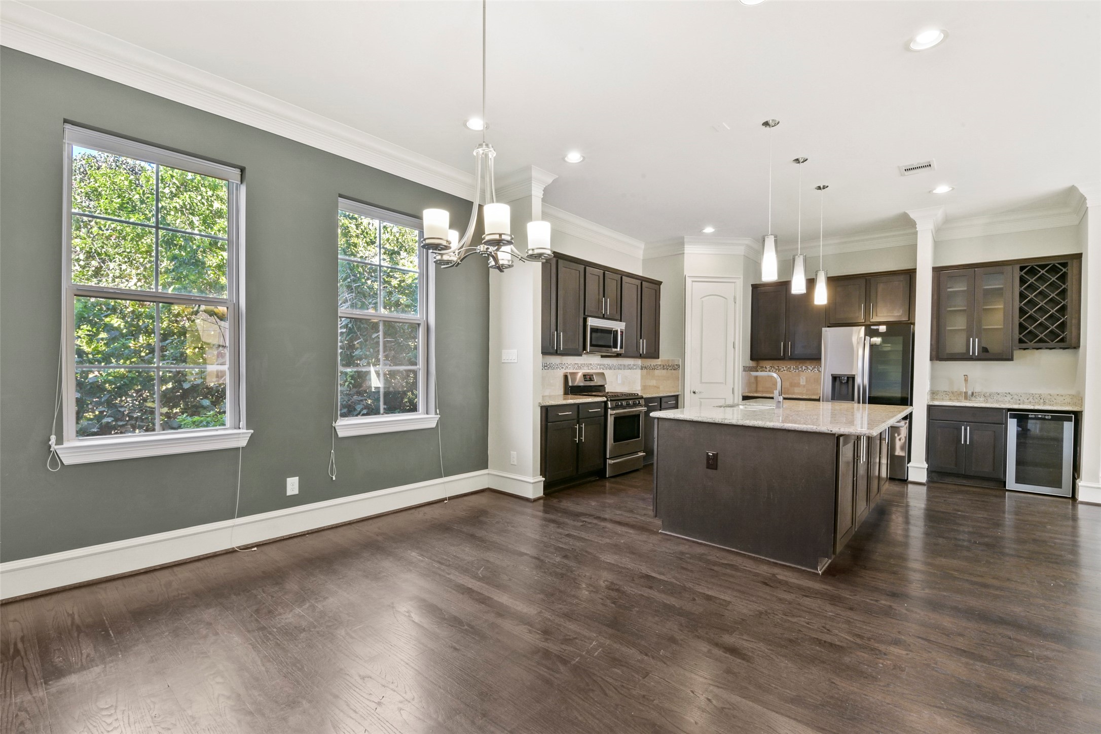 5226 Kiam Street, Unit 1018 Houston, TX 77007 - Photo 18 of 44 a kitchen with a sink stainless steel appliances and windows
