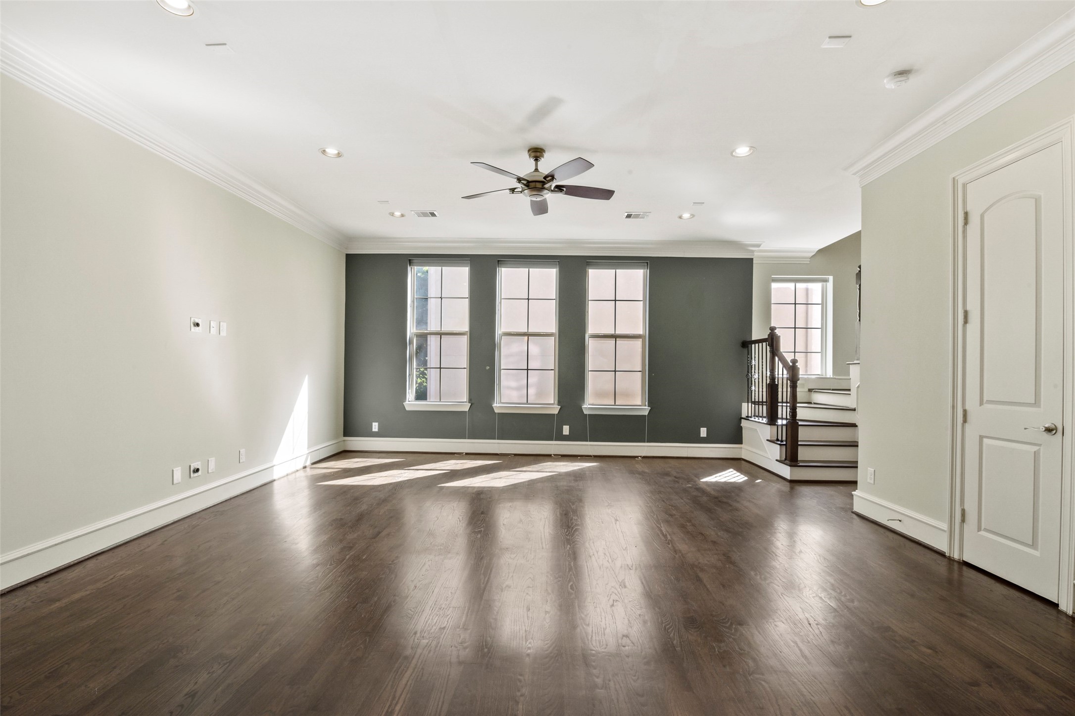 5226 Kiam Street, Unit 1018 Houston, TX 77007 - Photo 22 of 44 a view of an empty room with a window and wooden floor