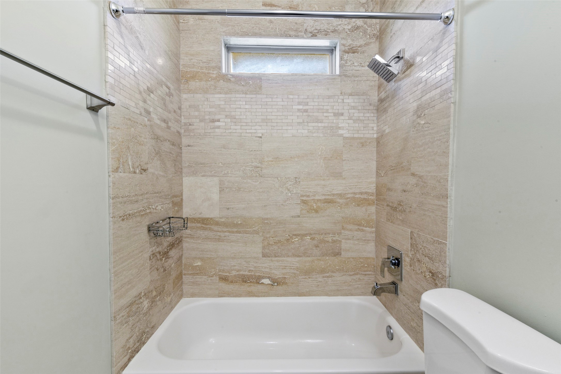 5226 Kiam Street, Unit 1018 Houston, TX 77007 - Photo 34 of 44 a bathroom with a shower and a toilet