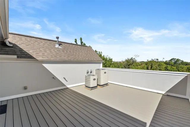 a view of roof deck with lawn chairs and wooden floor