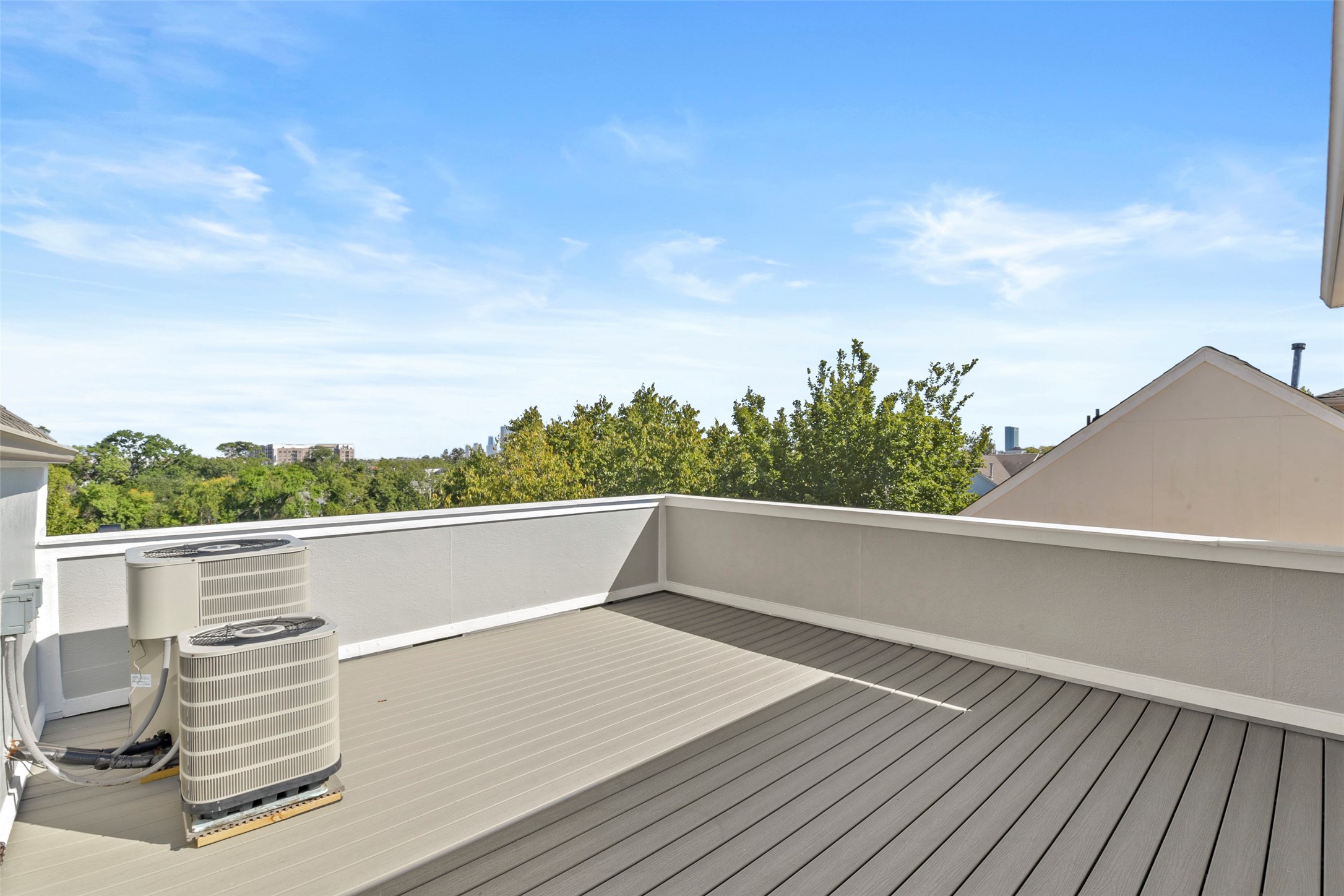 5226 Kiam Street, Unit 1018 Houston, TX 77007 - Photo 41 of 44 a view of roof deck with lawn chairs and wooden floor