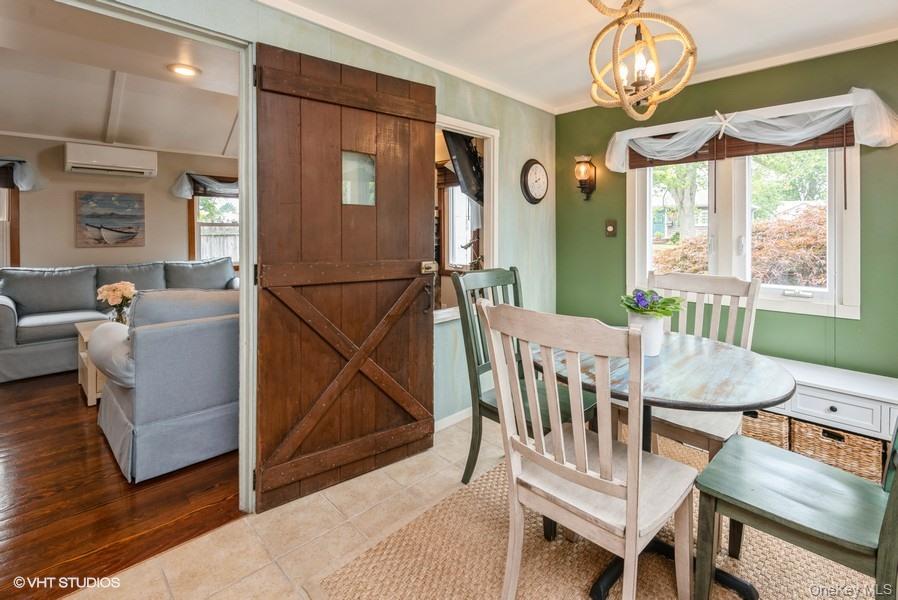 10 Stuart Avenue Babylon, NY 11702 - Photo 11 of 32 a view of a dining room with furniture window and wooden floor