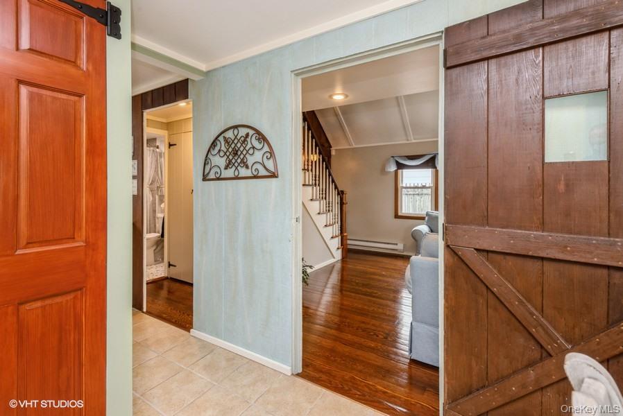 10 Stuart Avenue Babylon, NY 11702 - Photo 12 of 32 a view of livingroom with furniture and wooden floor