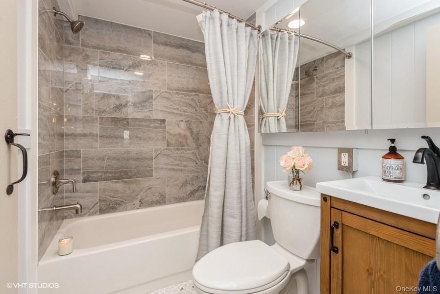 10 Stuart Avenue Babylon, NY 11702 - Photo 17 of 32 a bathroom with a sink toilet and shower