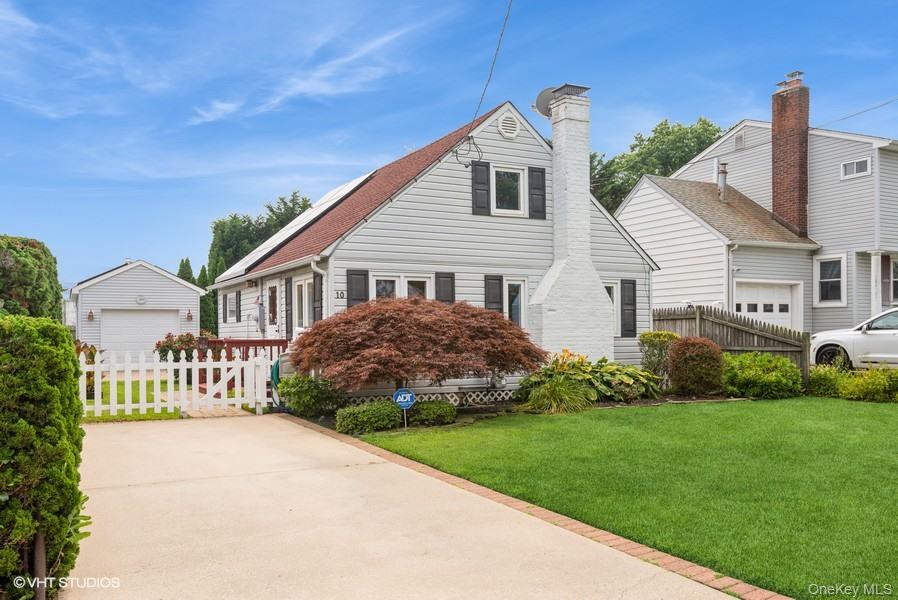 10 Stuart Avenue Babylon, NY 11702 - Photo 2 of 32 a front view of a house with garden