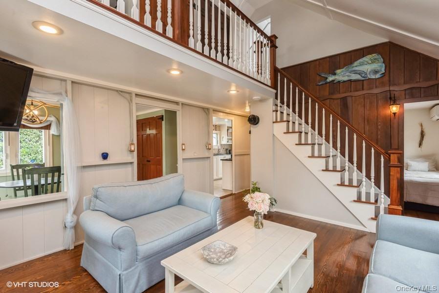 10 Stuart Avenue Babylon, NY 11702 - Photo 21 of 32 a living room with furniture and a flat screen tv