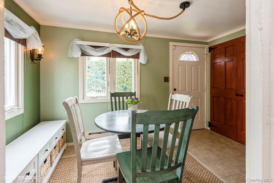 10 Stuart Avenue Babylon, NY 11702 - Photo 22 of 32 a view of a dining room with furniture window and outside view