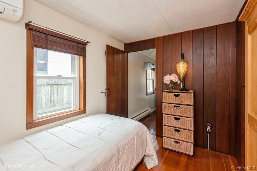 10 Stuart Avenue Babylon, NY 11702 - Photo 25 of 32 a bedroom with a bed and a dresser