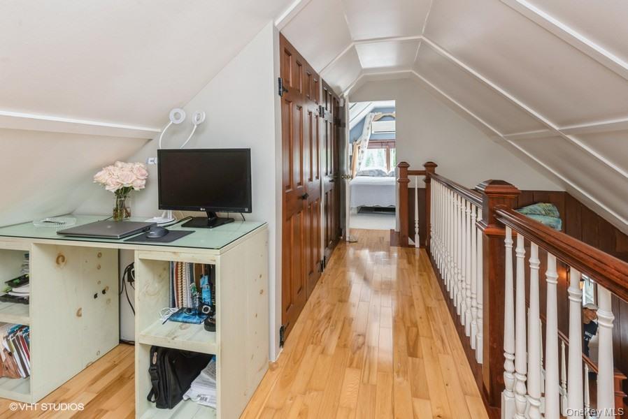 10 Stuart Avenue Babylon, NY 11702 - Photo 28 of 32 a view of a hallway with workspace and wooden floor