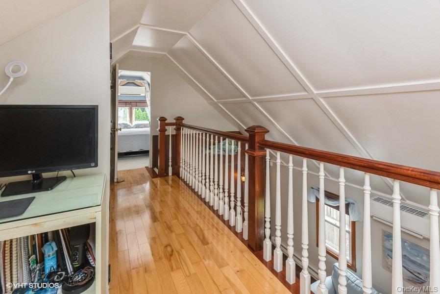 10 Stuart Avenue Babylon, NY 11702 - Photo 29 of 32 a view of a livingroom with wooden floor and a flat screen tv