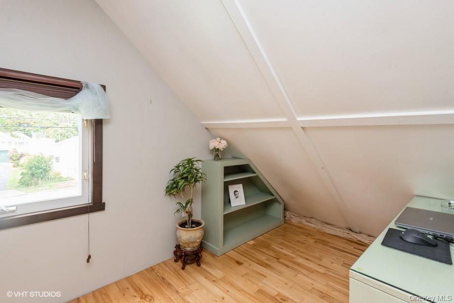 10 Stuart Avenue Babylon, NY 11702 - Photo 30 of 32 a view of entryway with wooden floor and stairs