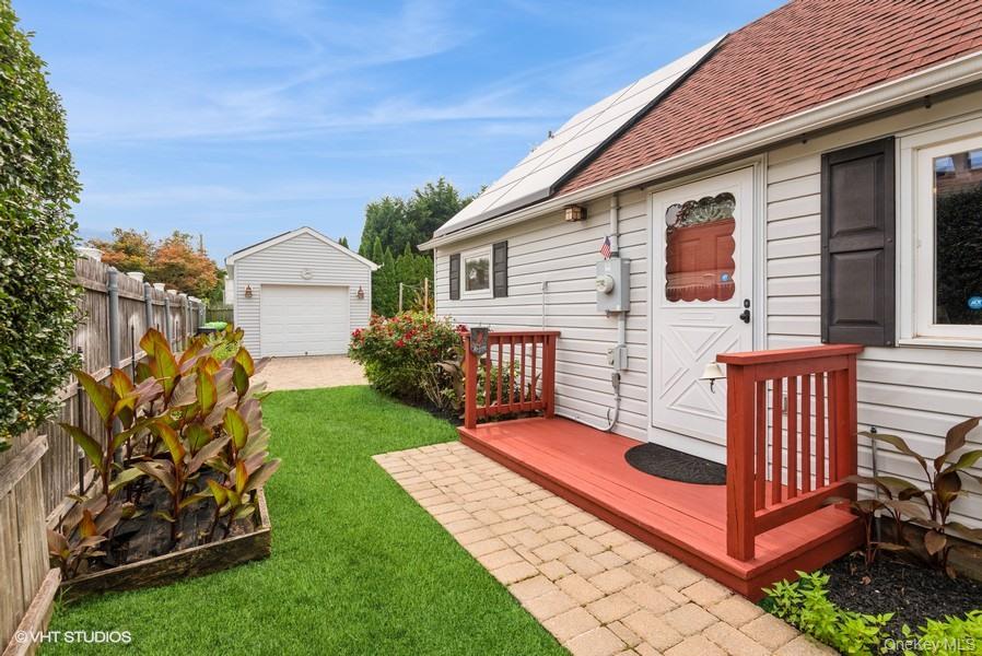 10 Stuart Avenue Babylon, NY 11702 - Photo 3 of 32 a front view of a house with garden