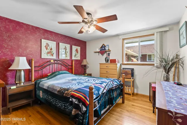 a bed room with a bed and a chandelier