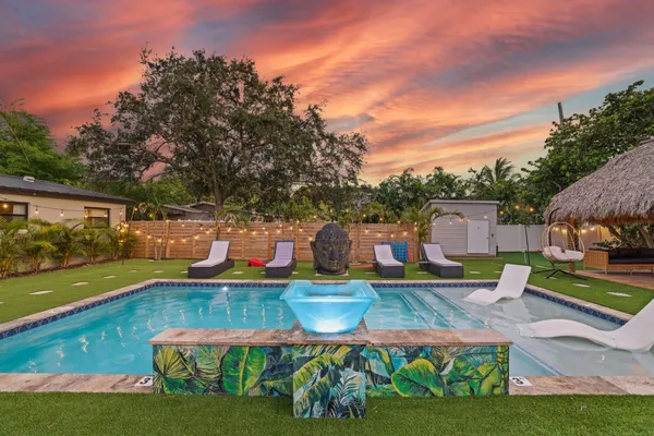 a view of a swimming pool with a patio