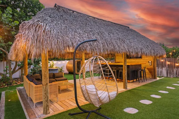 a view of yard with swimming pool and sitting area