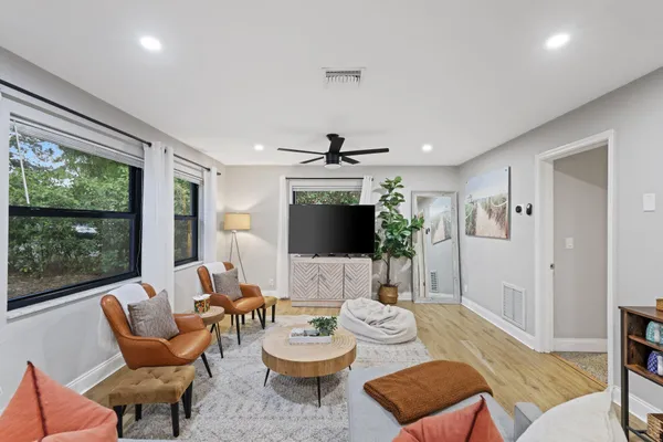 a living room with furniture and a large window