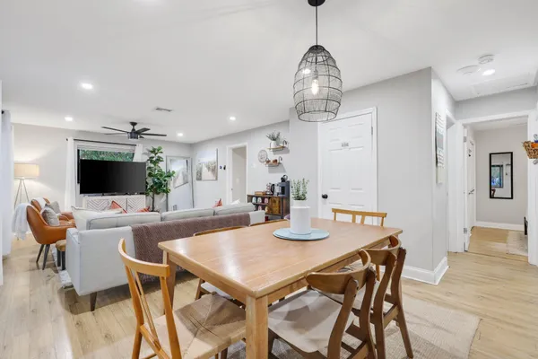 a kitchen with granite countertop a stove sink and cabinets