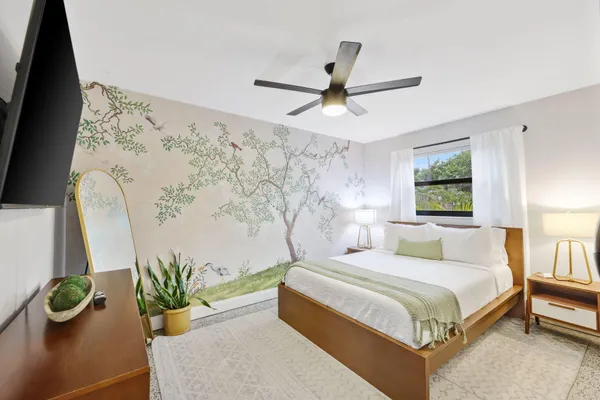a bedroom with a bed and a table in it
