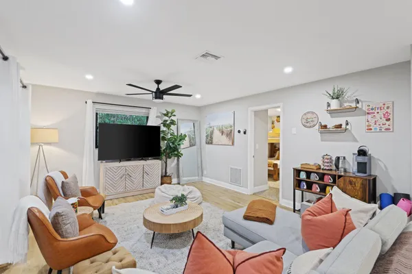 a bedroom with a bed and ceiling fan