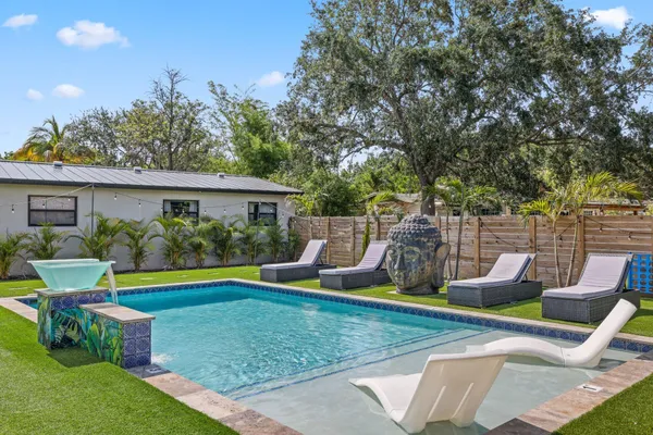 a view of a swimming pool with a patio