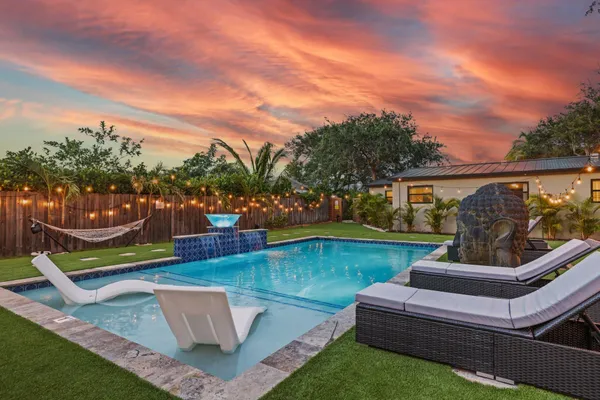 a view of a swimming pool with a patio