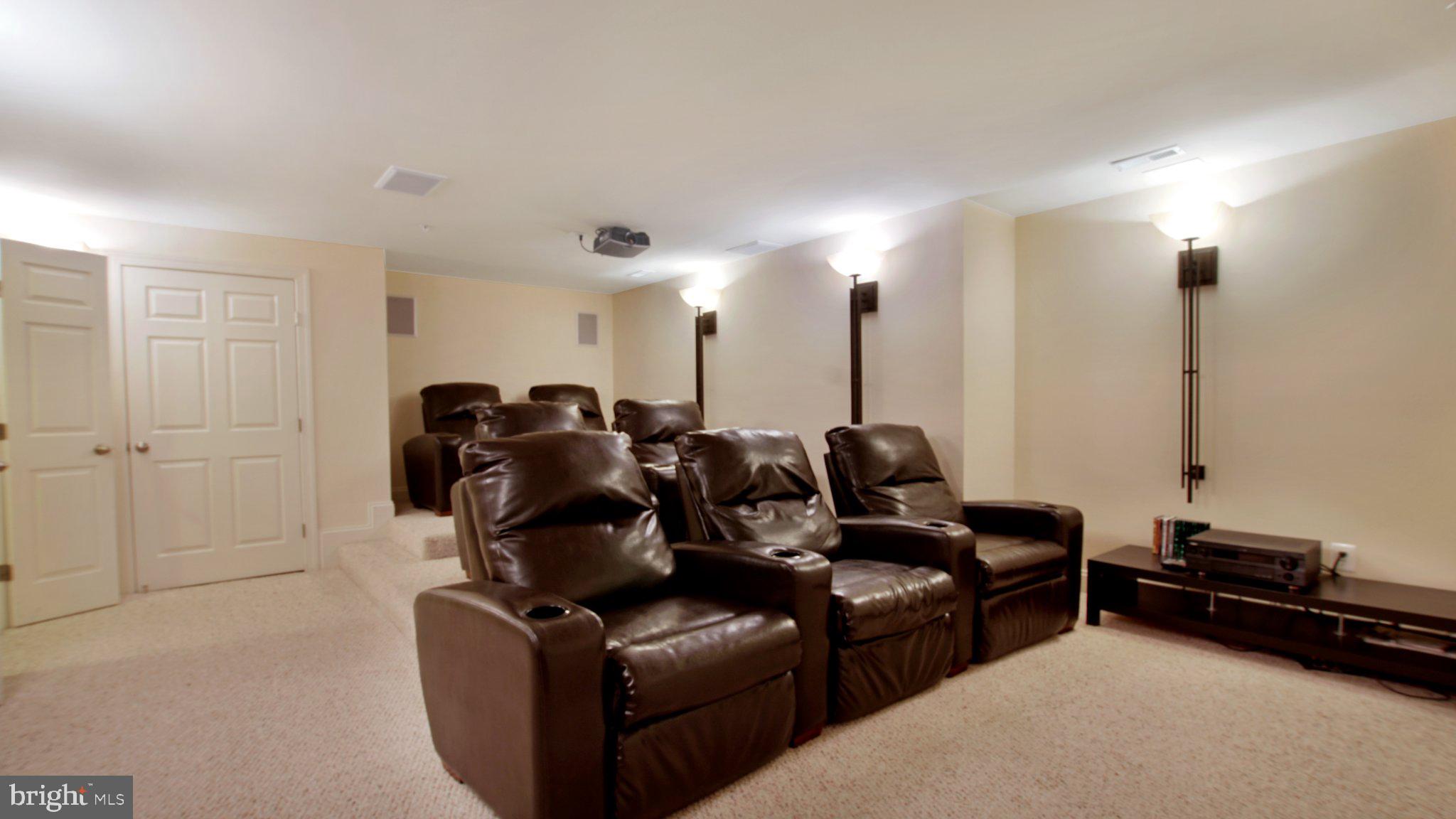8901 Normal School Road Bowie, MD 20715 - Photo 56 of 82 LOWER LEVEL THEATER ROOM WITH 7 LOUNGE CHAIRS..