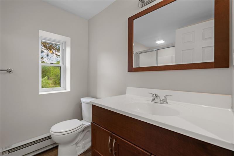 1122 Pittsburgh Road Valencia, PA 16059 - Photo 17 of 18 a bathroom with a sink mirror and toilet