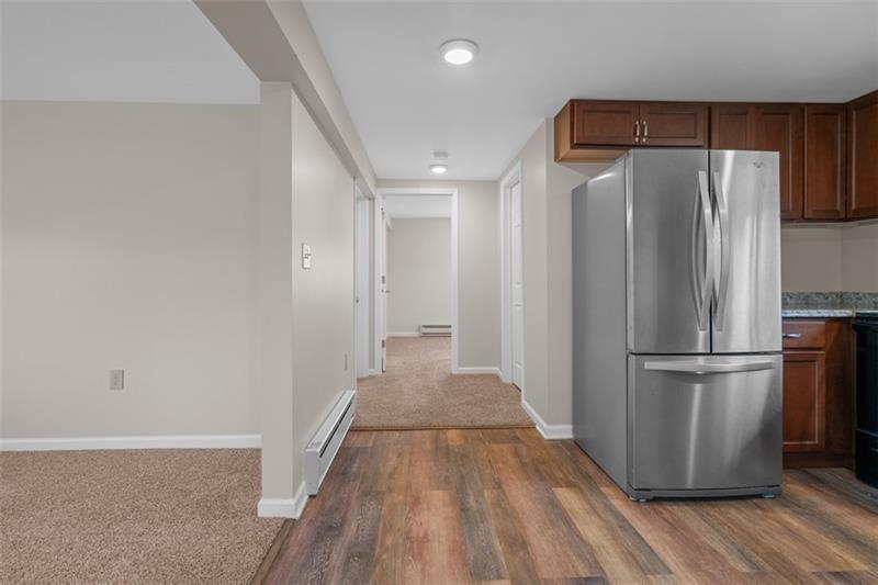 1122 Pittsburgh Road Valencia, PA 16059 - Photo 7 of 18 a view of a refrigerator in kitchen and wooden floor