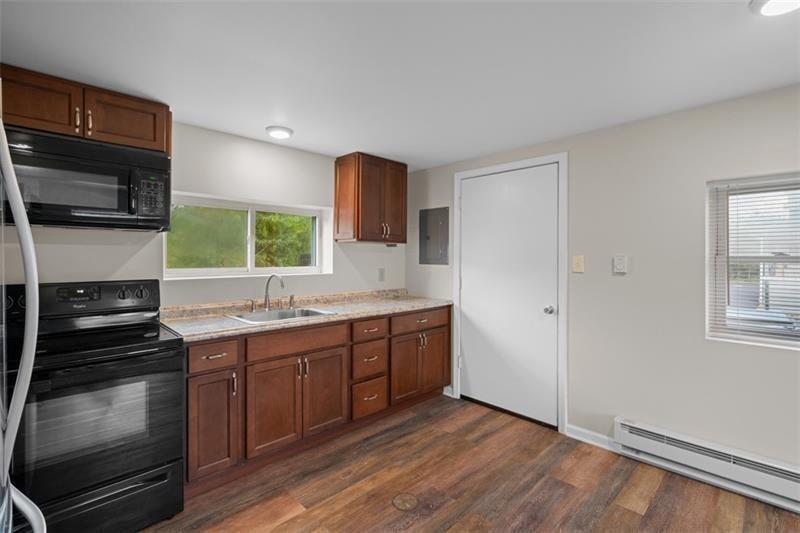 1122 Pittsburgh Road Valencia, PA 16059 - Photo 9 of 18 a kitchen with a sink stove and microwave