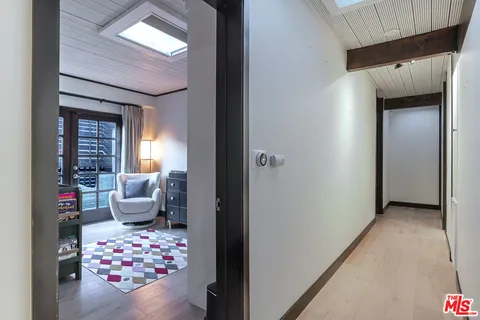 a bedroom with furniture and a chandelier