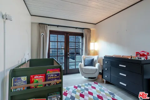 a living room with furniture and a gate