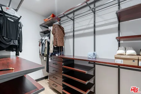 a kitchen with a sink appliances and cabinets