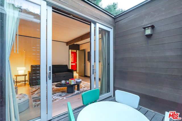 a bathroom with a bathtub sink mirror and toilet