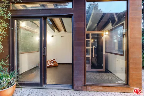 swimming pool with outdoor seating and plants